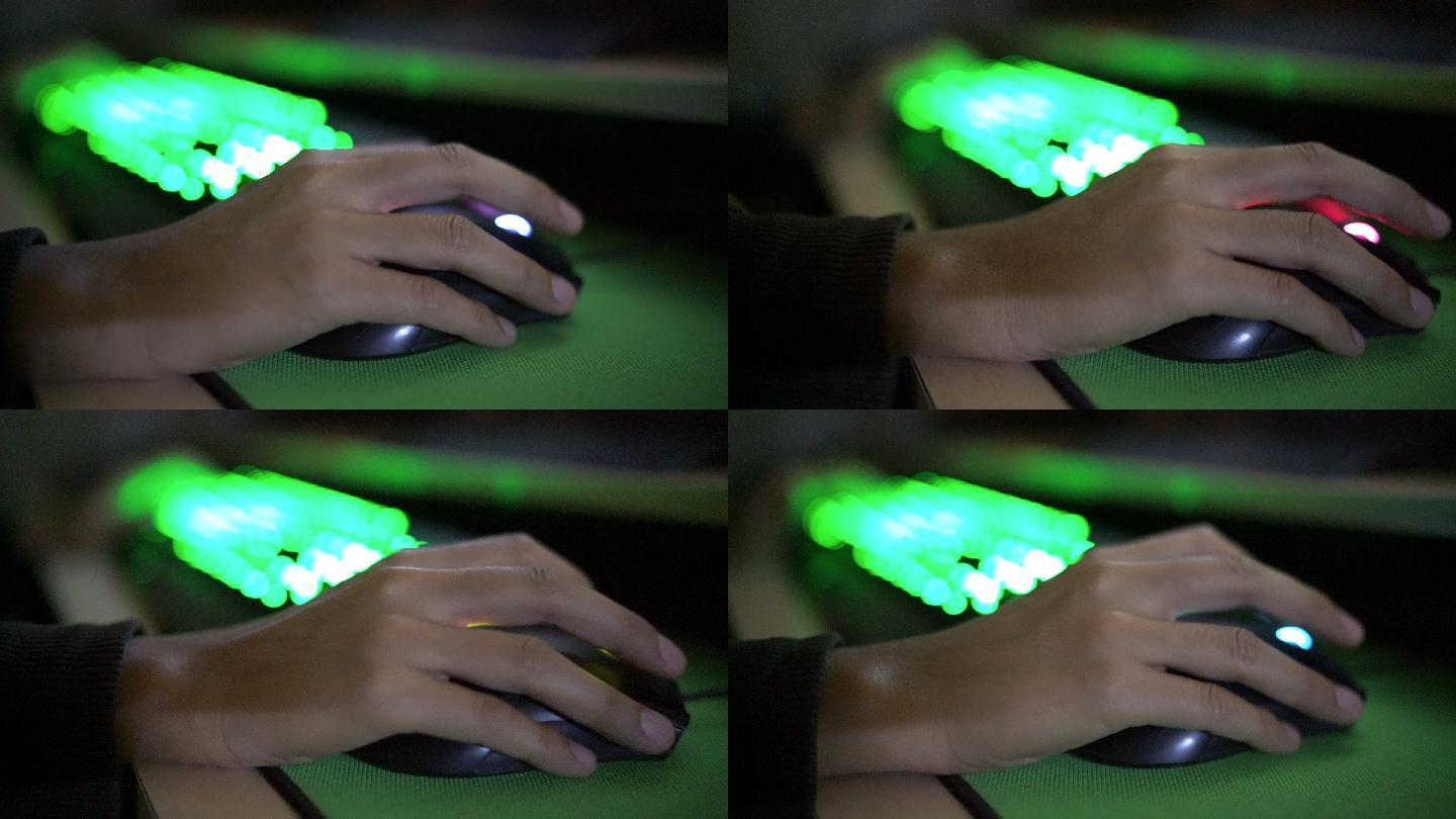 玩家在黑暗中使用游戏鼠标和LED键盘