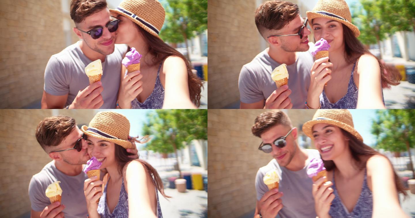 在吃冰淇淋的情侣美丽的人亲吻放松