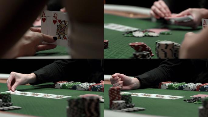 一名女子在玩德州扑克时检查她的底牌