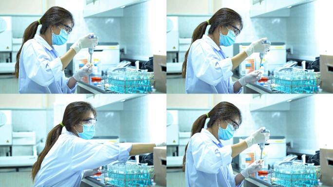 穿白色防护服的女科学家在实验室做实验