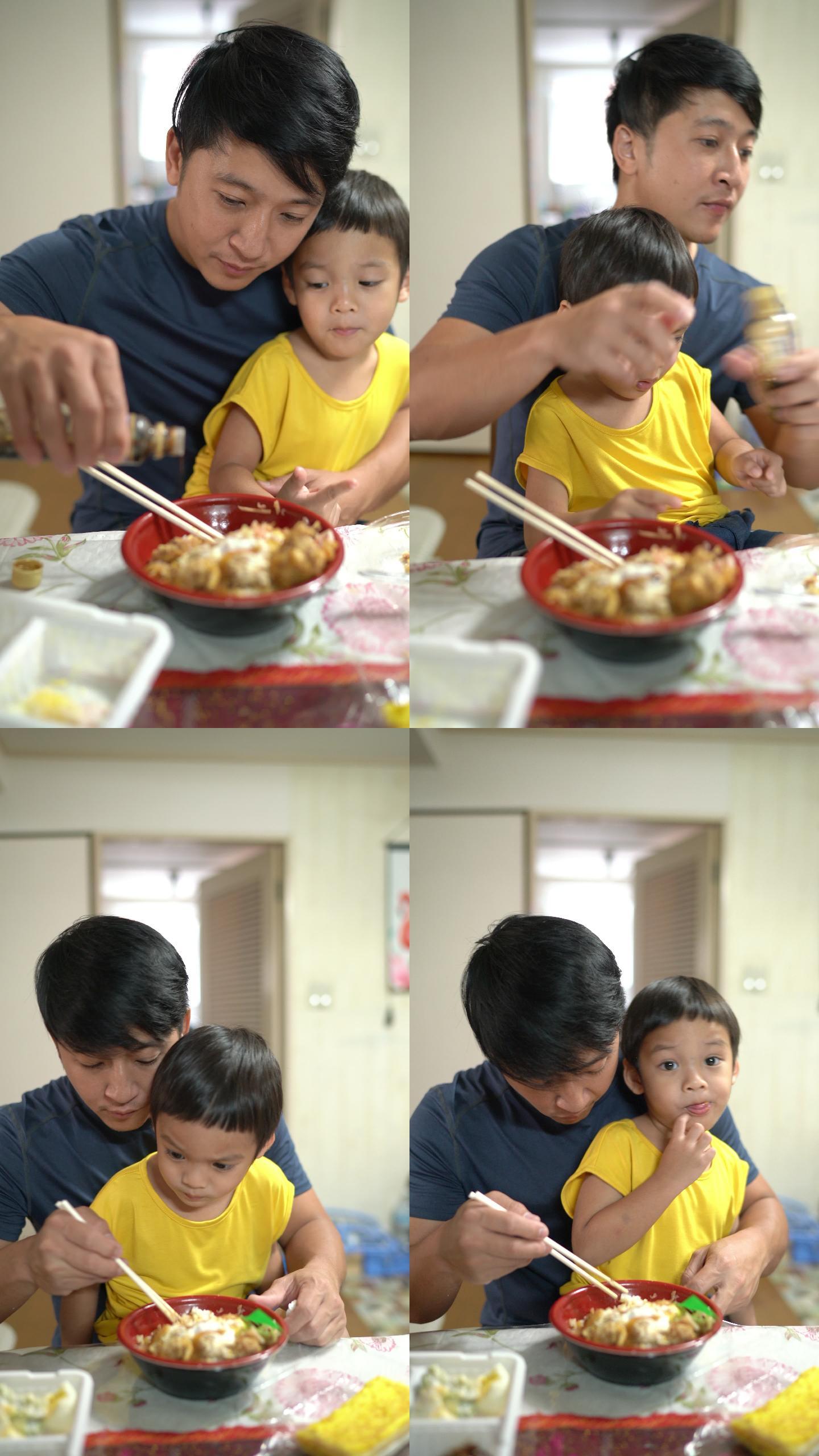 垂直-两张父子吃日本料理的照片