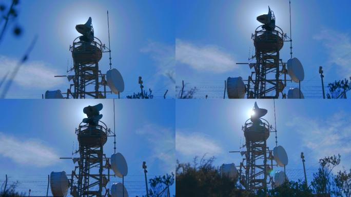山顶上装有旋转无线电探测天线的天气雷达
