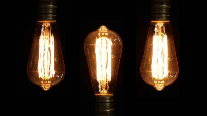 逐个亮起暖光的灯泡科技发明创造人类进步