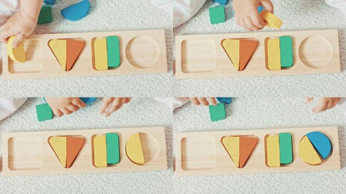 孩子玩木制玩具婴儿分拣机与几何图形