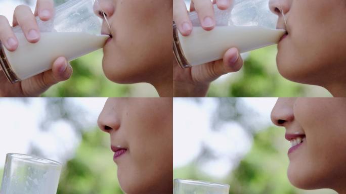 特写可爱的女孩喝鲜奶的镜头