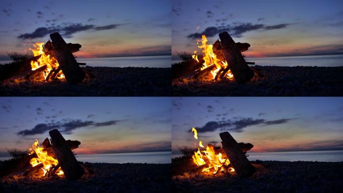 海滩上的篝火露营户外夜晚帐篷野外聚会休闲