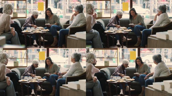 几名妇女一起在咖啡馆读书