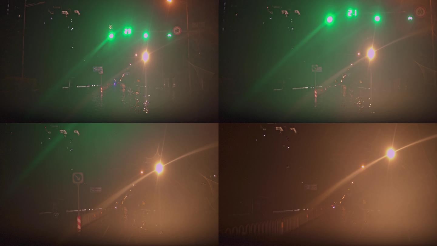 夜晚下雨天水中通过红绿灯