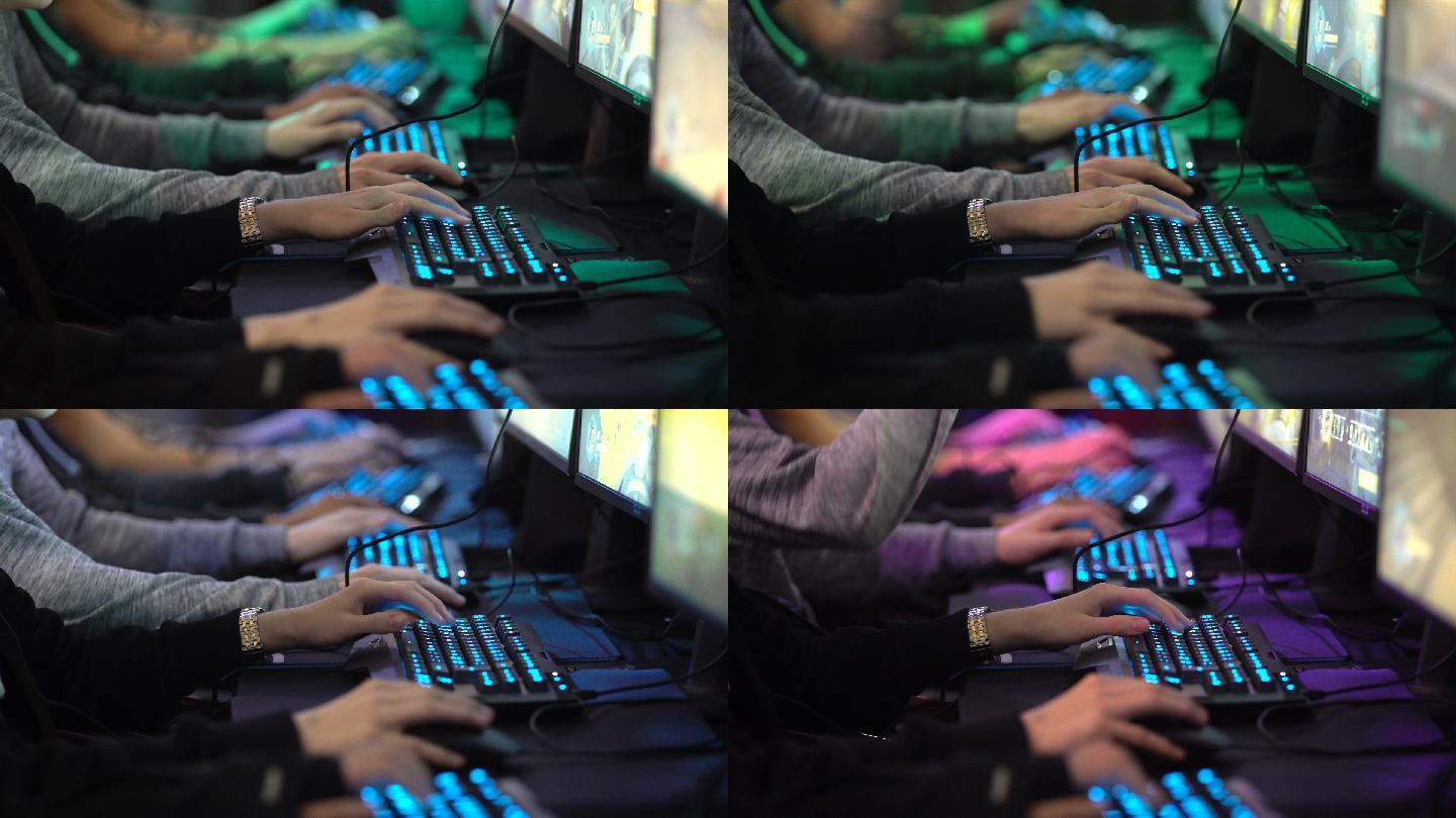 许多青少年玩电脑游戏。手和屏幕特写