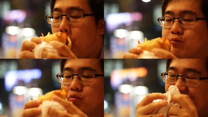 一个人正在吃汉堡包