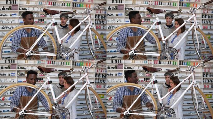 技工向一对夫妇展示自行车