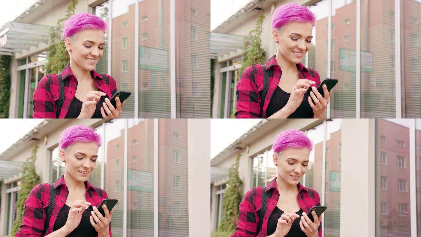 粉色短发的女人一边走路一边玩手机