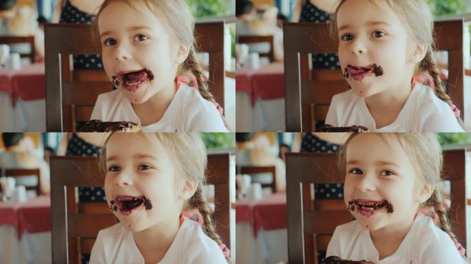 正在吃巧克力甜面包的小女孩