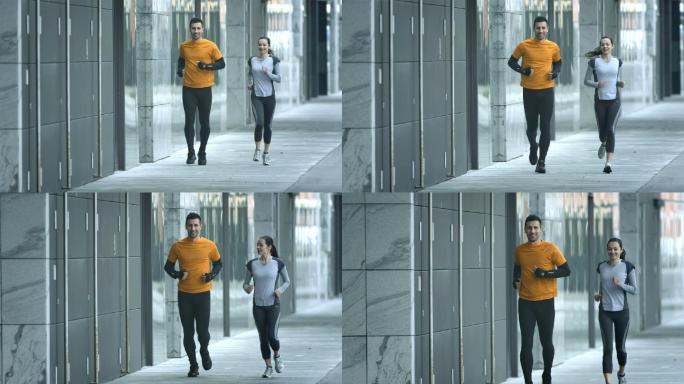慢镜头：情侣沿着人行道慢跑