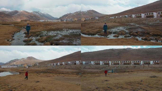 4k西藏风光视频枯黄草地上走过的游客