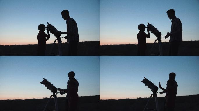 男人和男孩用望远镜观望天空