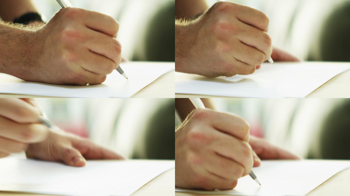 一个人用笔在空白页上写字