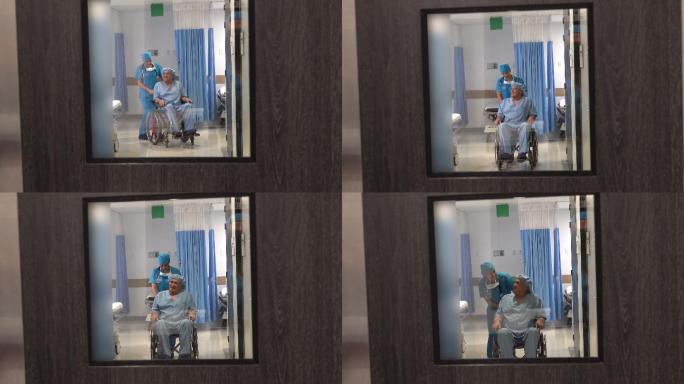 女护士推着轮椅上的老年病人去手术