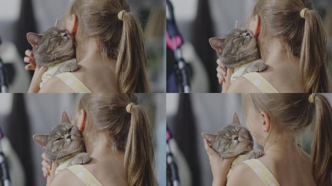 女孩抱着一只猫的特写镜头
