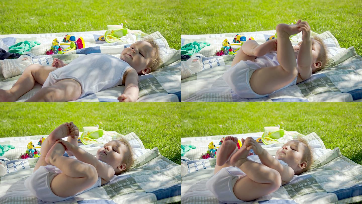 宝宝躺在户外在大自然中蹬腿玩耍