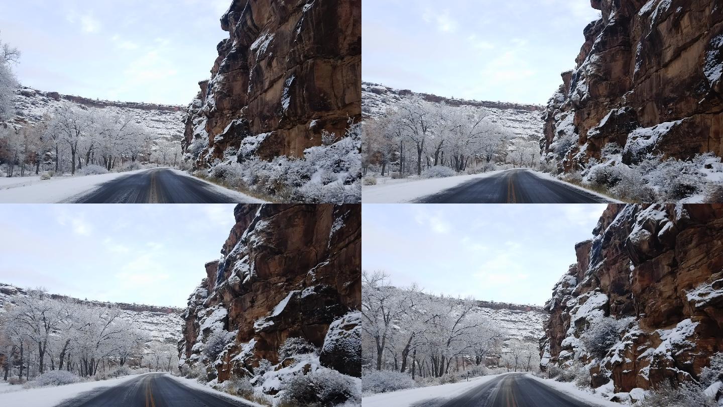 在冬天开车穿过雪山的道路