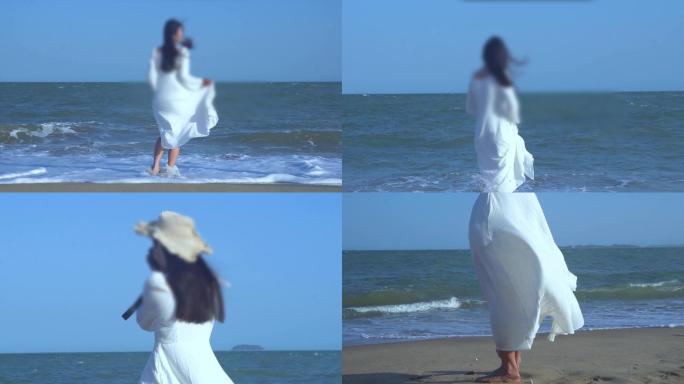 白裙子美女海边散步大海沙滩