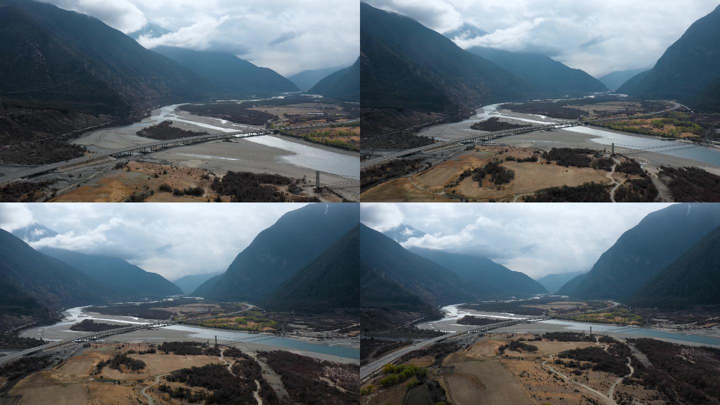 4k西藏风光视频玉带云山下河床沙洲公路桥
