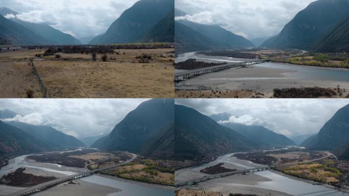 4k西藏风光视频玉带云山下河床公路桥
