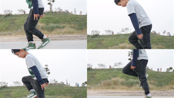 男孩在公园边锻炼边跳舞