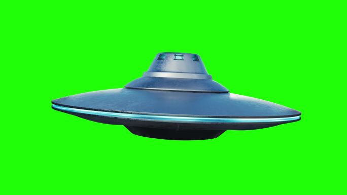 不明飞行物外星飞船在绿色背景上飞行