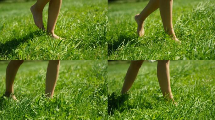 女人的脚在绿草上行走的特写镜头