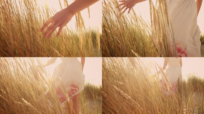 在草丛抚摸野草的女人