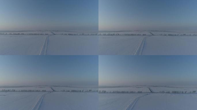 航拍空镜内蒙古冬雪景草原公路地平线