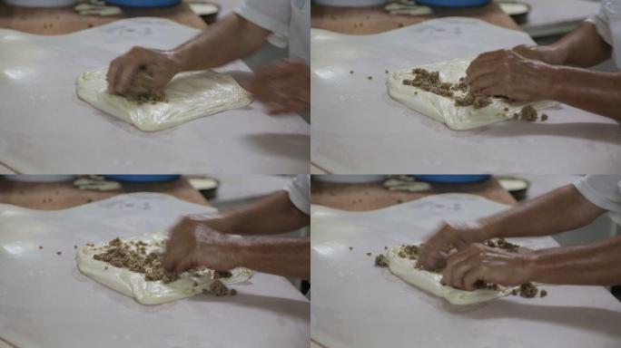 有技术的人正在面包房做传统的馅饼