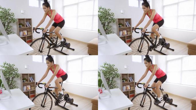 自行车手她在家里锻炼。