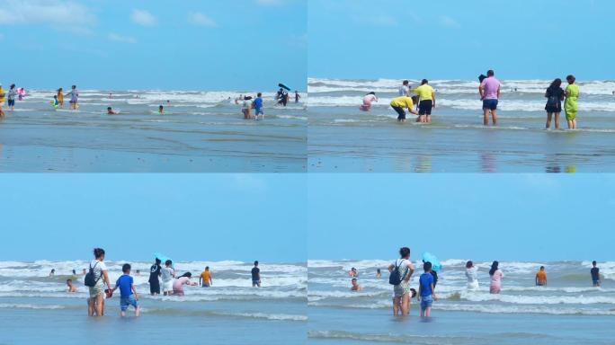 大海边冲浪玩水的人群
