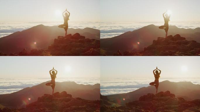 在山顶上做瑜伽姿势的女人