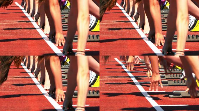 女子短跑运动员从起跑台起跑