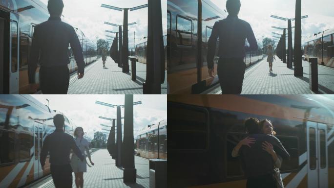 男人在火车站见面拥抱女友
