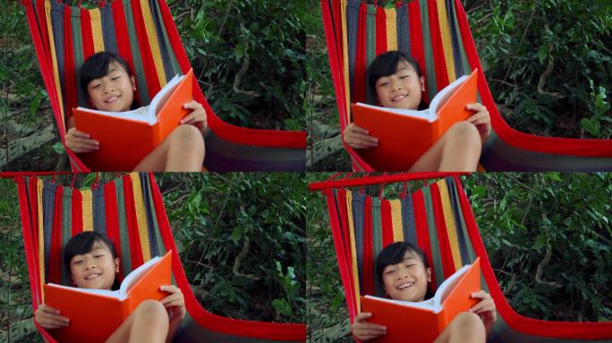 小女孩读故事书孩子笑脸和谐社会开心高兴