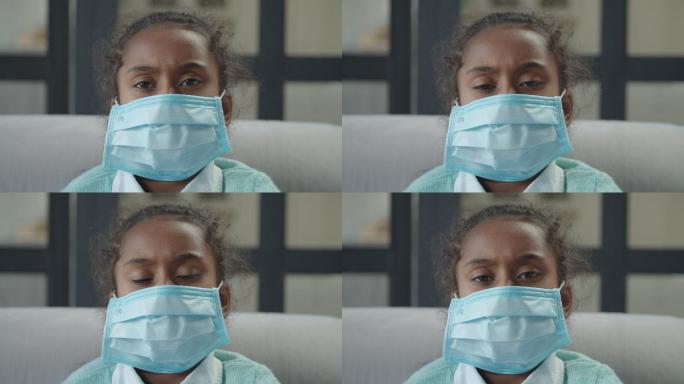 生病的女孩戴口罩防止病菌传播