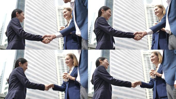 现代办公楼里商务人士互相问候握手