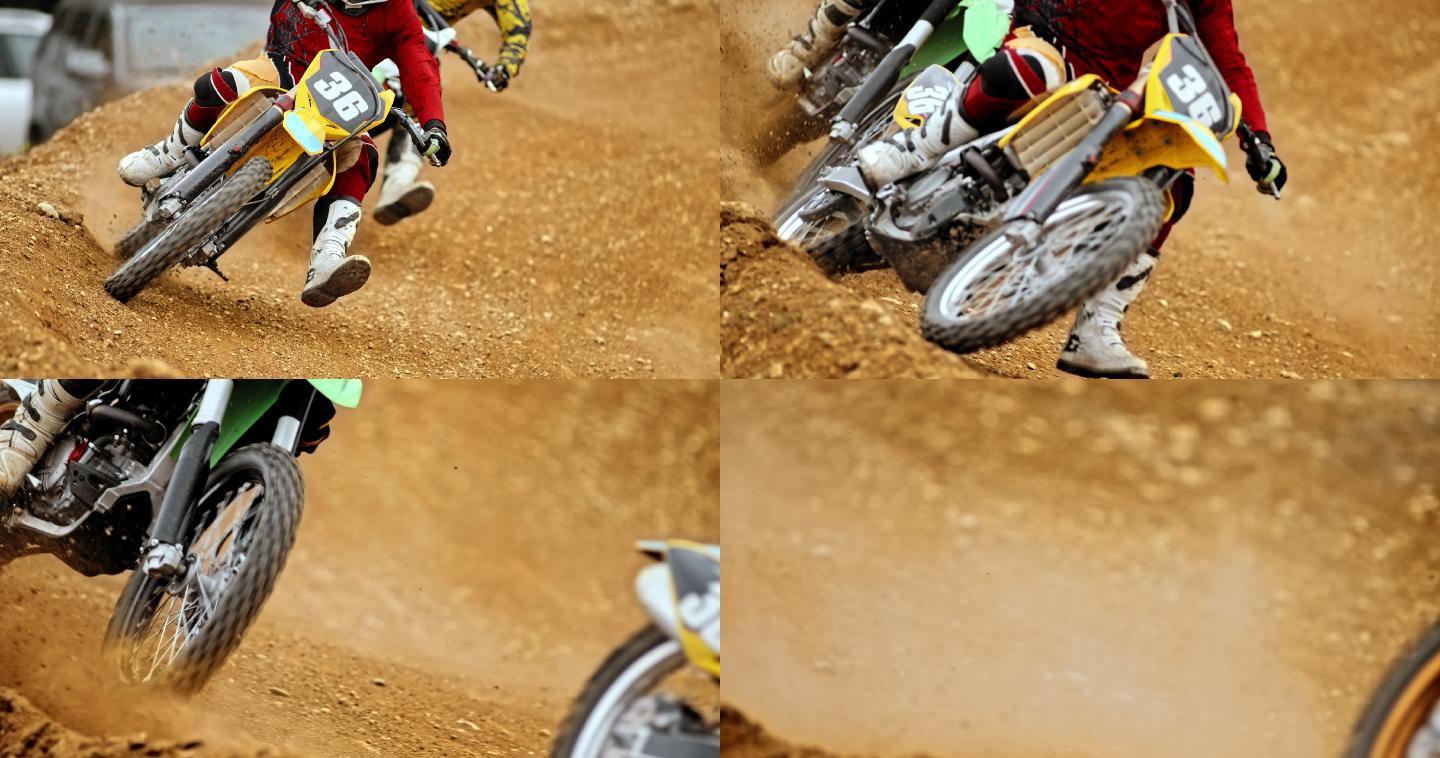 摩托车越野车手在泥土跑道上比赛