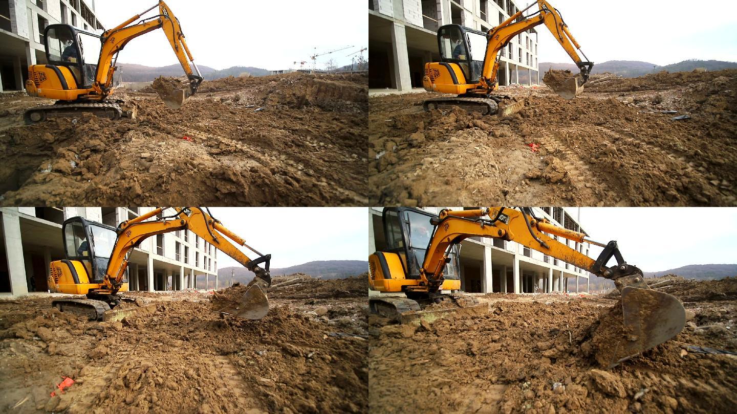 挖掘机挖坑扔土的慢动作