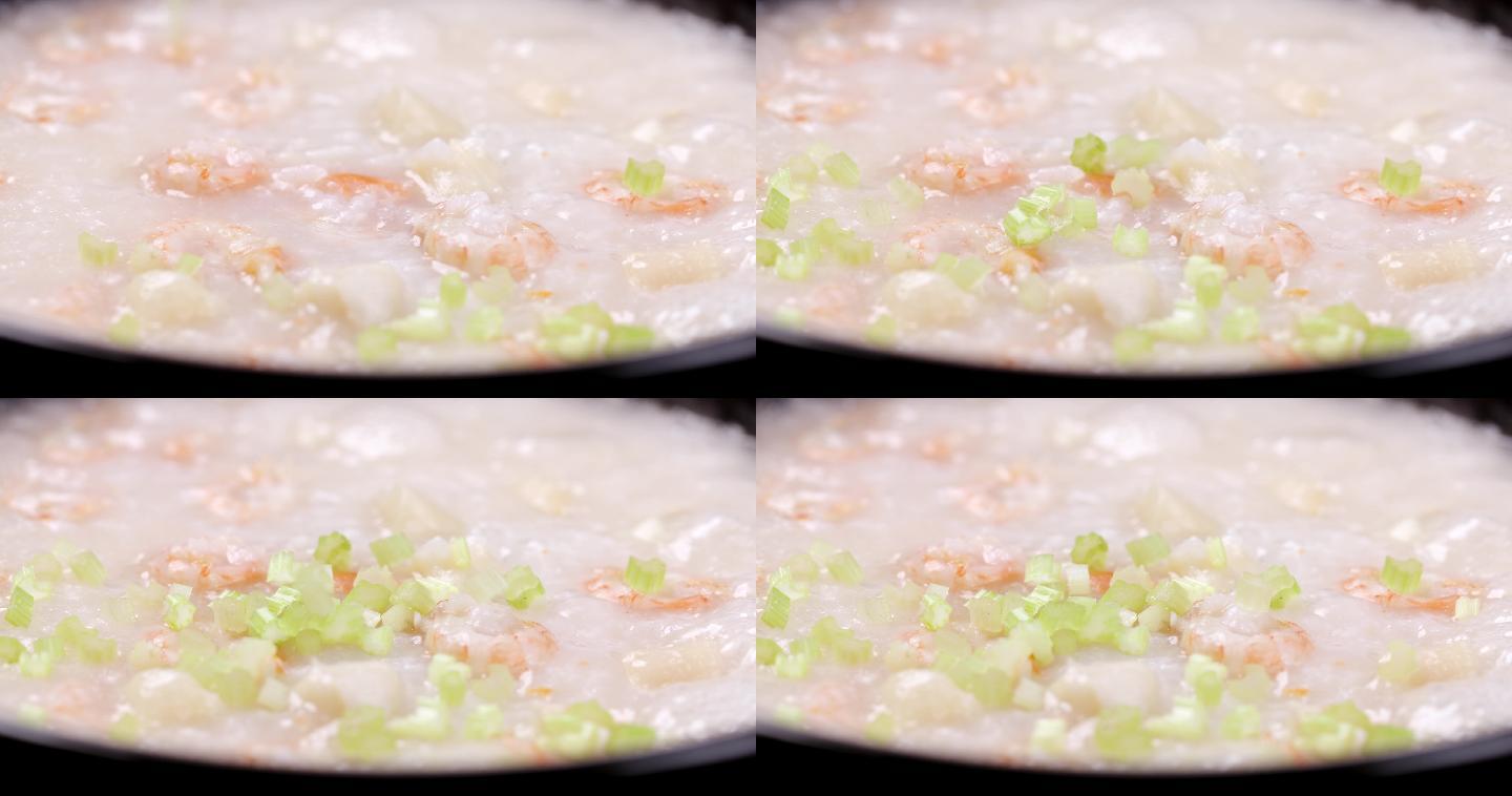 【正版素材】海鲜粥特写芹菜碎落入固定