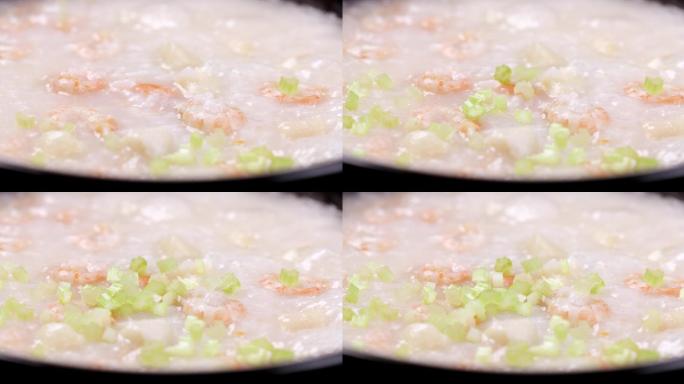 【正版素材】海鲜粥特写芹菜碎落入固定