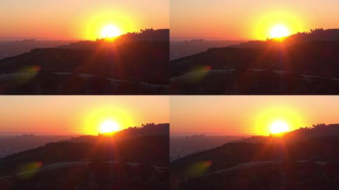 日落时分，人们在好莱坞峡谷徒步旅行