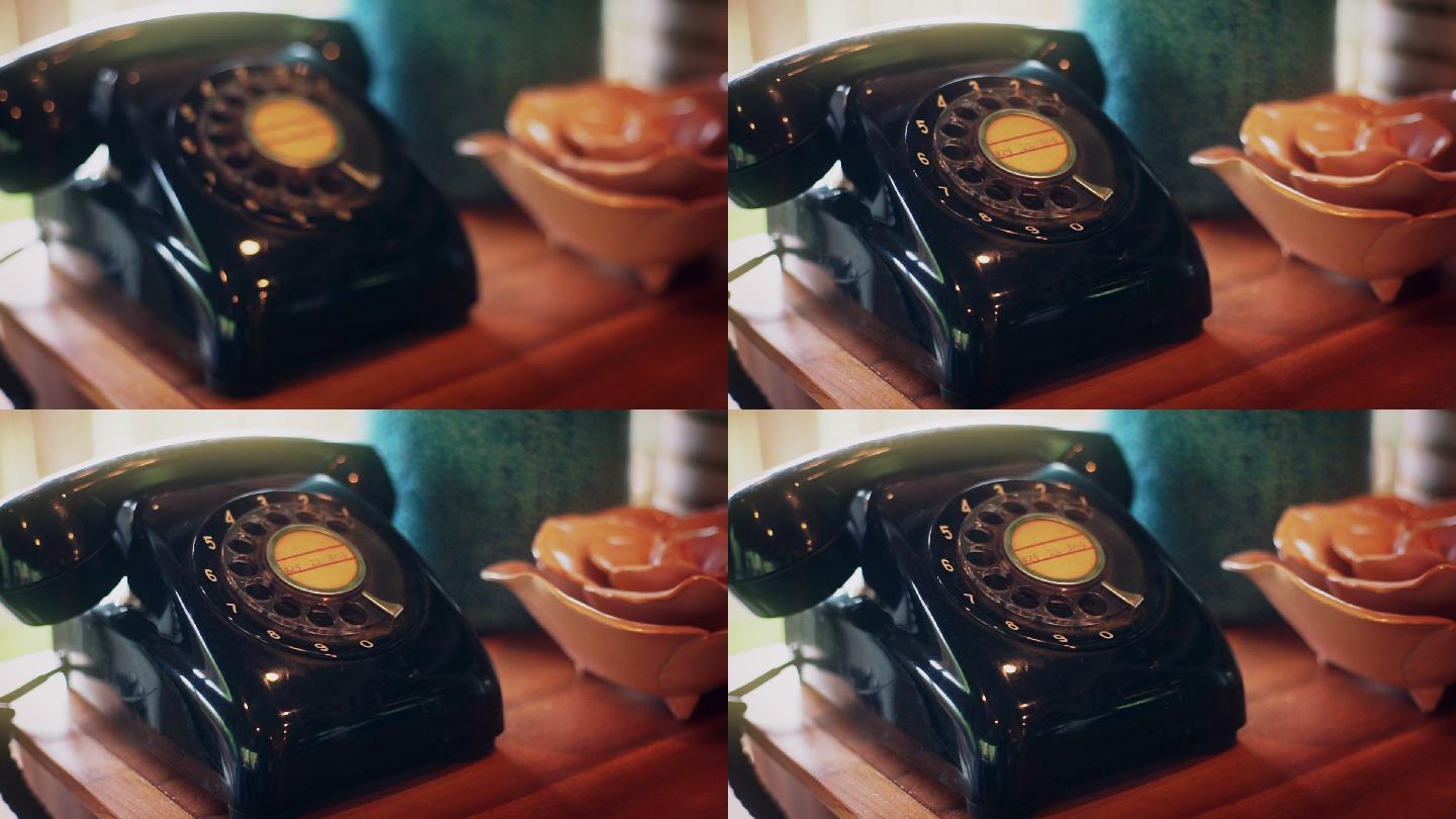 老式电话放在靠近窗户的木桌上
