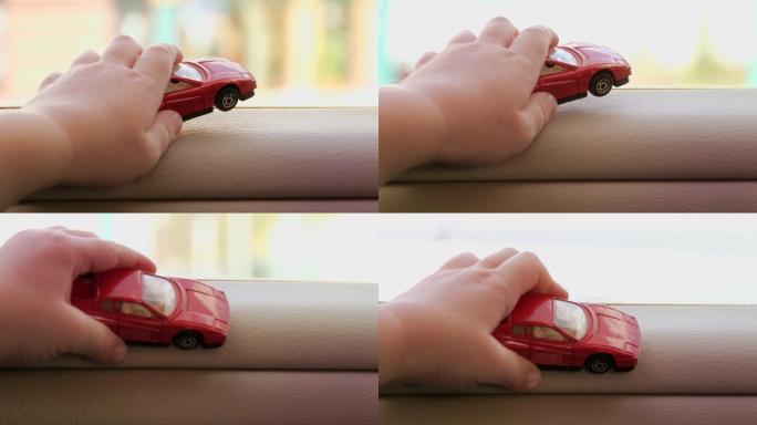 婴儿手中的汽车玩具