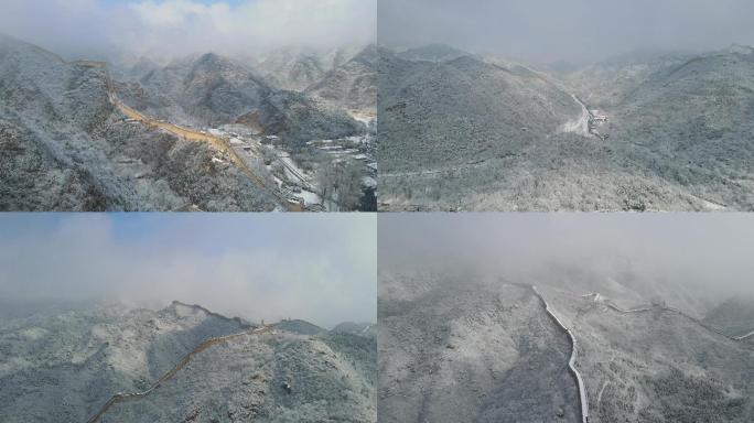 航拍雪后的北京水关长城